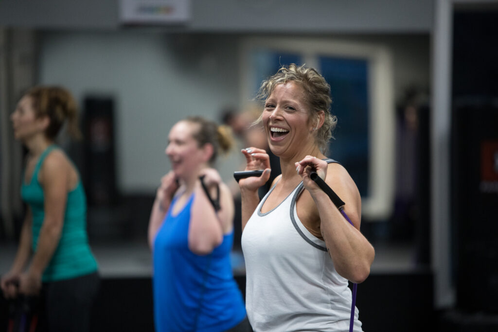 woman doing strength training workout with resistance bands